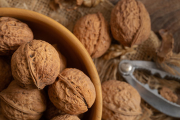 Walnuts kernels in wooden bowl, Walnut healthy food Top view
