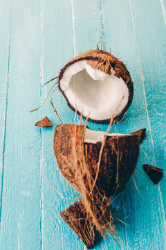 coconut on a blue wooden background, banner, copy space