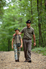 Naklejka na ściany i meble Ranger and his son in the woods