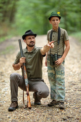 Ranger and his son in the woods