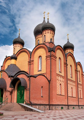 Fototapeta na wymiar Cathedral of the assumption of the pyukhtitsky Convention. Kuremae, Estonia. The five-domed Church was built in 1910. The monastery is located on the virgin mountain