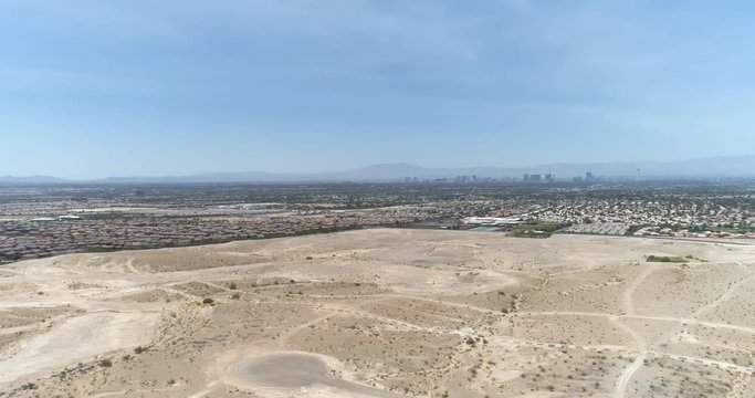 Pan of Southern Edge of Las Vegas Homes Along Desert