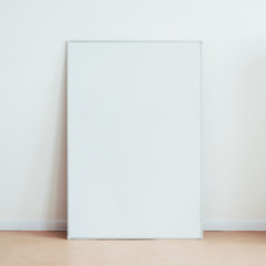 Blank white board on floor. Classroom or office business presentation