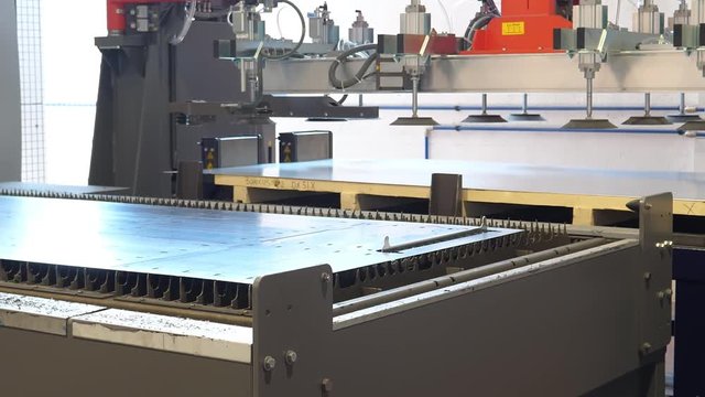 High-tech industrial production, new and processed sheet at CNC laser cutting, automated process