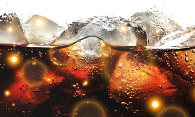 Fototapeta na wymiar Cola With Ice Cubes In Glass