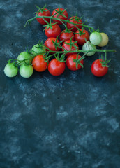 Cherry tomatoes on a dark background
