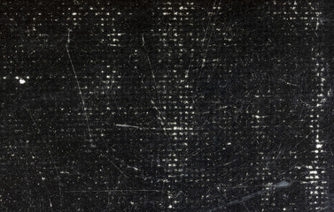 Scratched and grunge black canvas texture