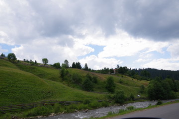 mountain landscapes among fields and green trees