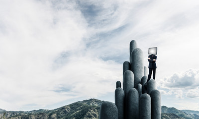 Businessman with TV instead of head.