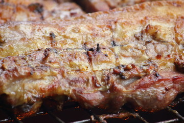 delicious food pork grilling on hot charcoal