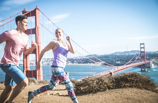 Couple running in San Francisco - Powered by Adobe