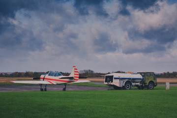 aerobatic aeroplane on ground in autumn