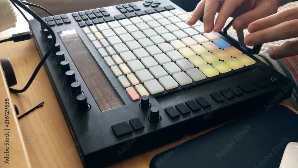Poster man making beat on a midi pad controller