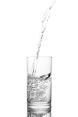 Water poured in  glass transparent white background