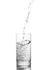 Water poured in  glass transparent white background