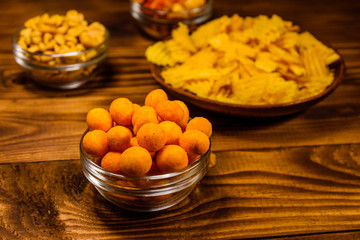 Different snacks for beer on wooden table