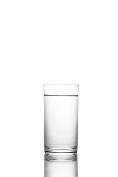 Water poured in  glass transparent white background