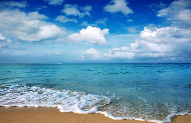 Caribbean sea and blue clouds sky.