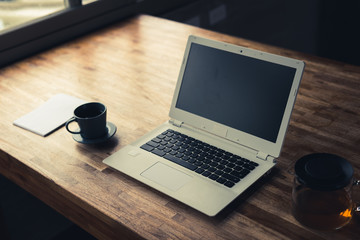 laptop on wooden desk