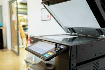 Bussiness man Hand press button on panel of printer, printer scanner laser office copy machine supplies start concept.