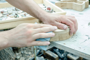 the carpenter polishes the product
