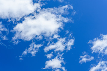 White fluffy clouds in a deep blue sky
