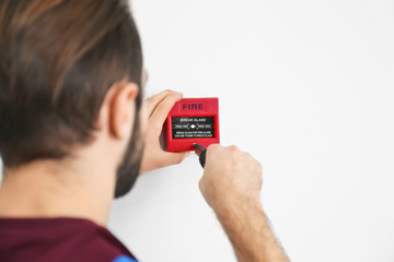 Electrician installing fire alarm system