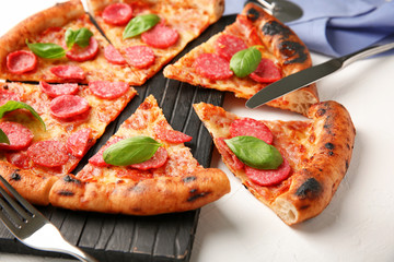 Tasty pepperoni pizza on table