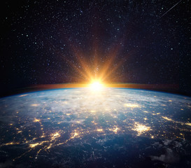 Earth, sun, star and galaxy. Sunrise over planet Earth, view from space. Elements of this image...