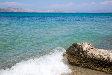 Kos, Marmari beach, Greece. Beautiful aegean sea and white sand. Transparent azur emerald turqouise...