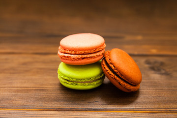 Ccolorful Macaroons on wooden background