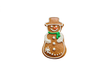 Traditional Christmas gingerbread cookie in the form of a snowman isolated on white background or cut out.