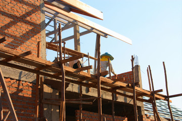 Naklejka premium A new house brick and mortar structure building and construction. 
