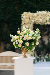 Beautiful flower decorations for the wedding ceremony. White roses