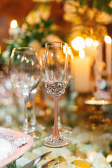 Sparkling glassware stands on table prepared for elegant wedding