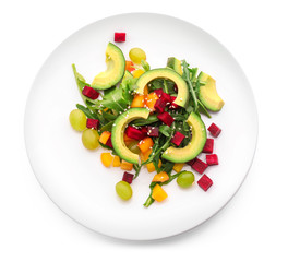 Plate with tasty avocado salad on white background