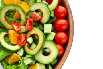 Plate with tasty avocado salad on white background