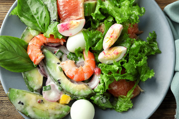 Tasty salad with ripe avocado on plate