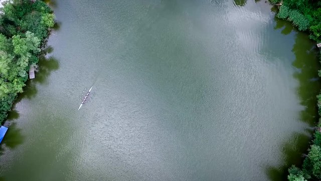 An Aerial View Of Four Crew Rowers In A Boat