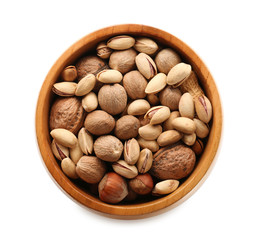 Bowl with various tasty nuts in white background