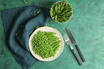 Obraz premium Composition with green peas on color table