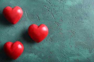 Red hearts on green background