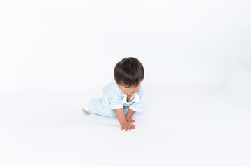 cute cheerful crawling baby boy isolated on white background