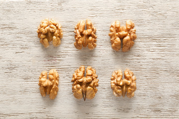Fototapeta premium Tasty walnuts on wooden background
