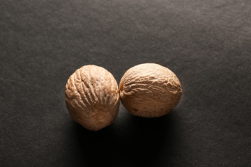 Nutmegs on dark background