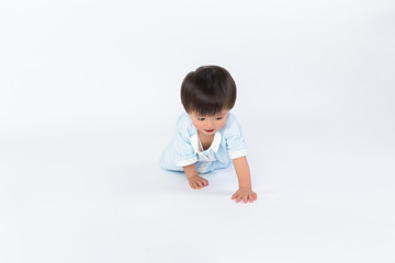cute cheerful crawling baby boy isolated on white background