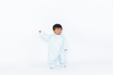 Infant child baby girl kid toddler in diaper make first steps isolated on a white background