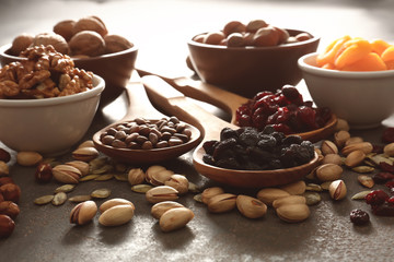 Assortment of dried fruits and nuts on grunge table