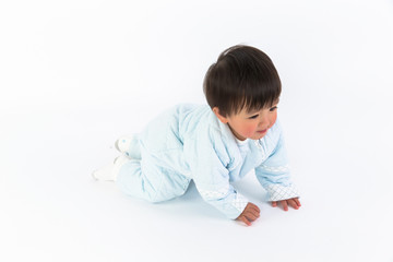 cute cheerful crawling baby boy isolated on white background