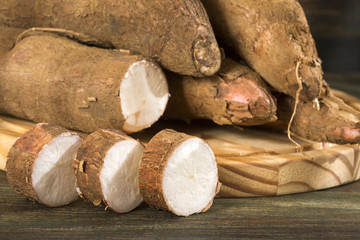 Raw cassava starch - Manihot esculenta. Wooden background